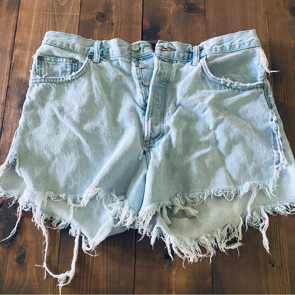 Agolde light wash distressed denim shorts